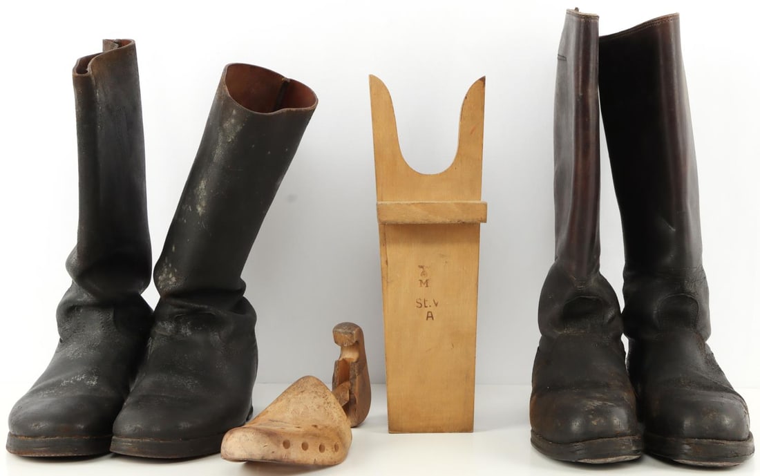 LOT 2 PAIR OF WWII GERMAN JACK BOOTS: One pair has horse shoe taps, each about a size 8 U.S., also a DRGBM shoetree, and Waffenampt boot pull. Very Good original condition.