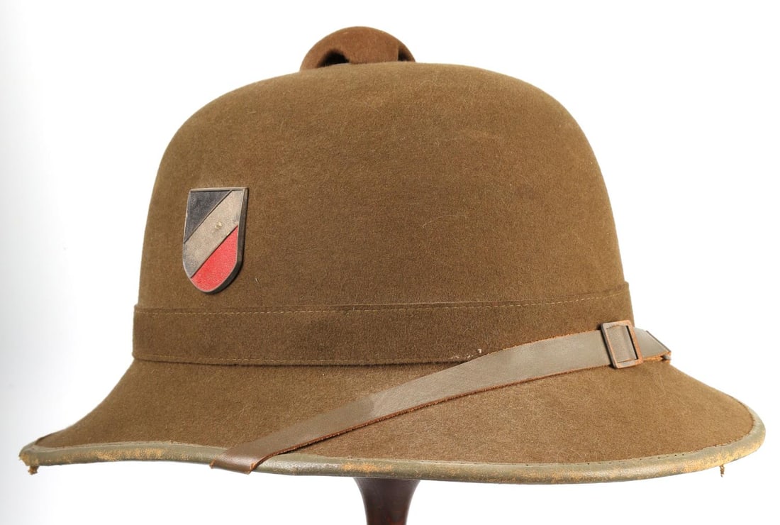 WWII GERMAN SS DAK AFRIKA KORP PITH HELMET: Original helmet, chin strap, suspension and colors shield, some light mothing visible only upon close inspection, probable original SS shield, uncertain if added later, sold as is.