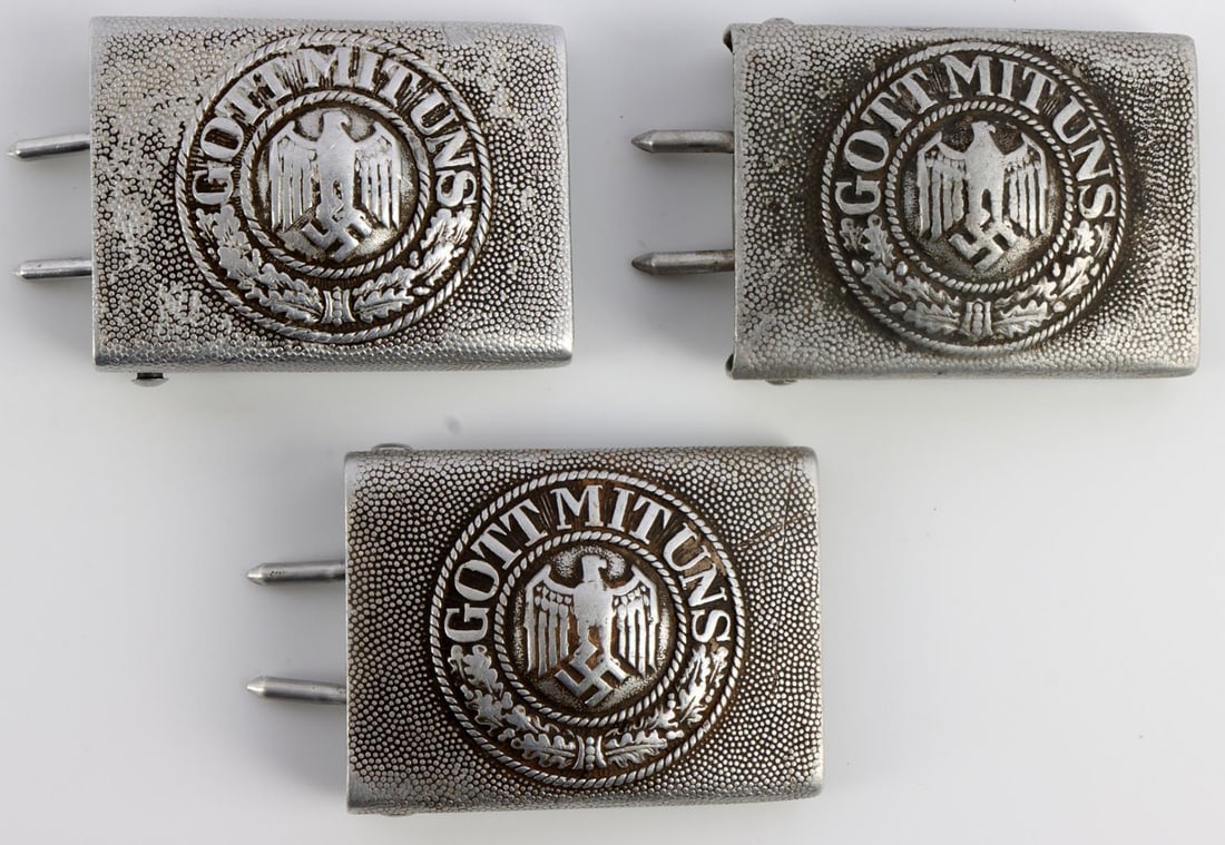 3 WWII GERMAN REICH HEER ENLISTED MEN BELT BUCKLES: Lot of three (3) WWII German Reich Heer army enlisted men aluminum belt buckles. Each reads, "GOTT MIT UNS". Two buckles have visible manufacturer marks to the reverse, "JMO" and "H.A.". Lot is in goo