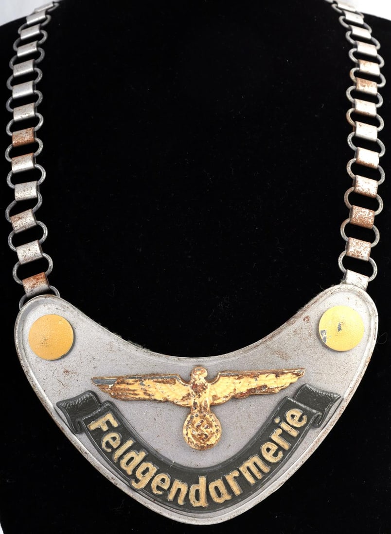 WWII GERMAN WEHRMACHT FELDGENDARMERIE GORGET: Phosphorous paint fluoresces as it should, reverse center Lugg stamped M, some loss to reverse felt and some paint loss otherwise good original condition.