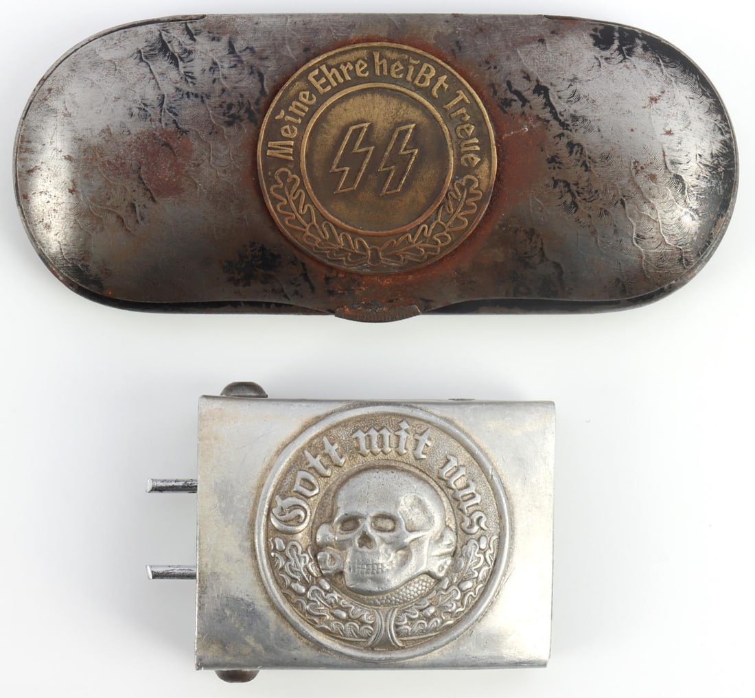 WWII GERMAN THIRD REICH SS BELT BUCKLE AND CASE: Army motto with totenkopf. Marked RZM M34/2. Case features SS medallion with motto in brass. Measures 5 1/8 inches. Very good condition. Unauthenticated, sold as is.