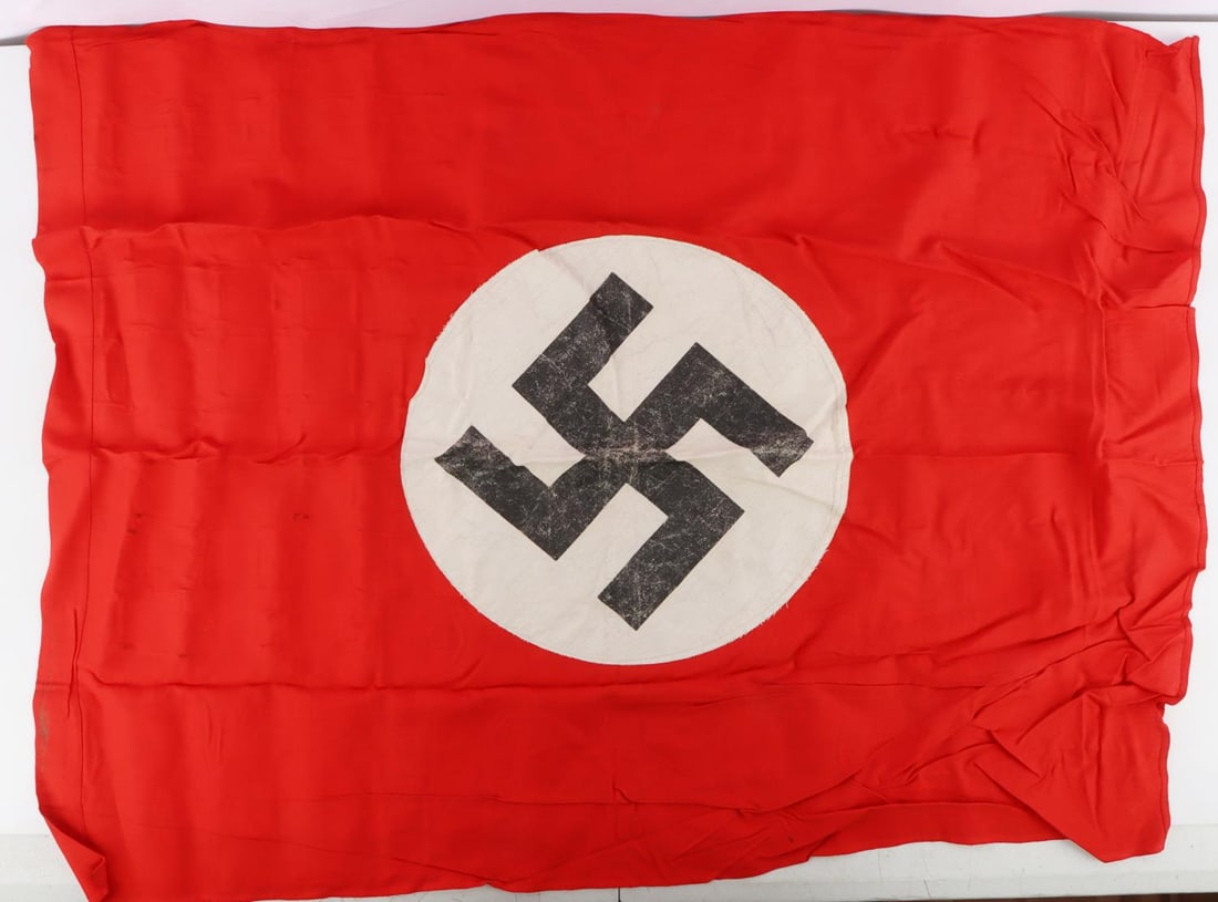 WWII GERMAN REICH NSDAP PARTY NATIONAL BANNER FLAG: WWII German Reich NSDAP party national banner flag. Multi-piece cotton construction. Double-sided with the swastika on either side. Flag does not fluoresce. Size is approx. 30 X 38 inches. Lot is in g