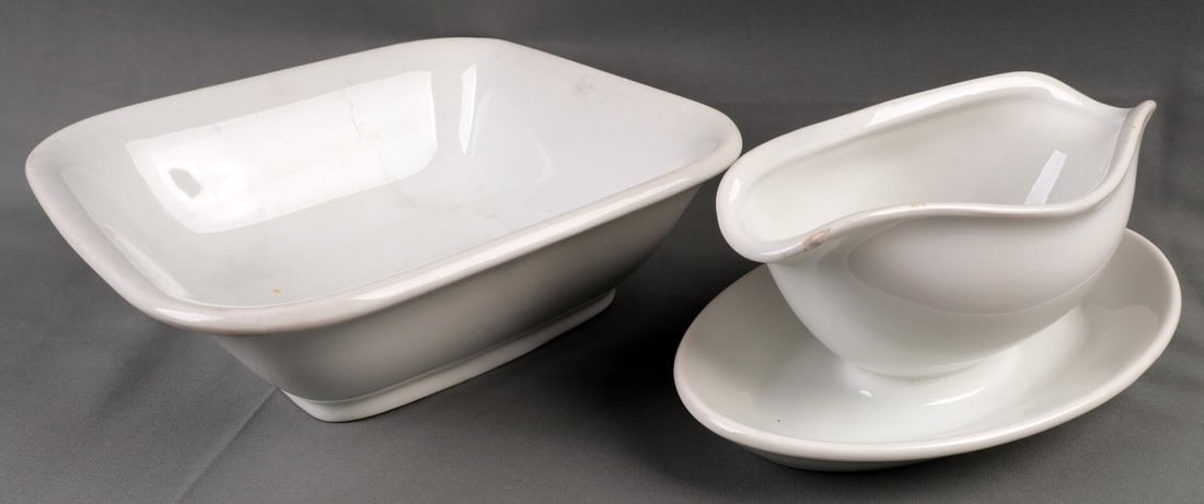 WWII GERMAN REICH HEER ARMY LARGE PORCELAIN BOWLS: Lot of two(2) WWII German Reich Heer Army Porcelain items including a gravy bowl and a large square bowl. Both porcelain items feature the Heer Army eagle insignia on the underside including matching 
