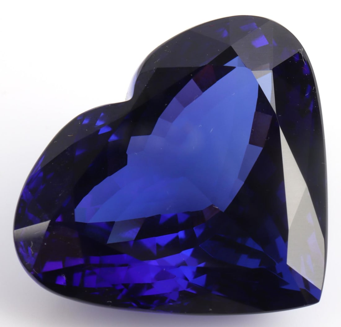 50 CARAT NATURAL TANZANITE HEART SHAPE W APPRAISAL: Unmounted heart shaped faceted natural tanzanite with appraisal. Appraisal states "medium to high intensity medium/dark slightly violetish-blue (daylight) medium to high intensity medium/dark slightly