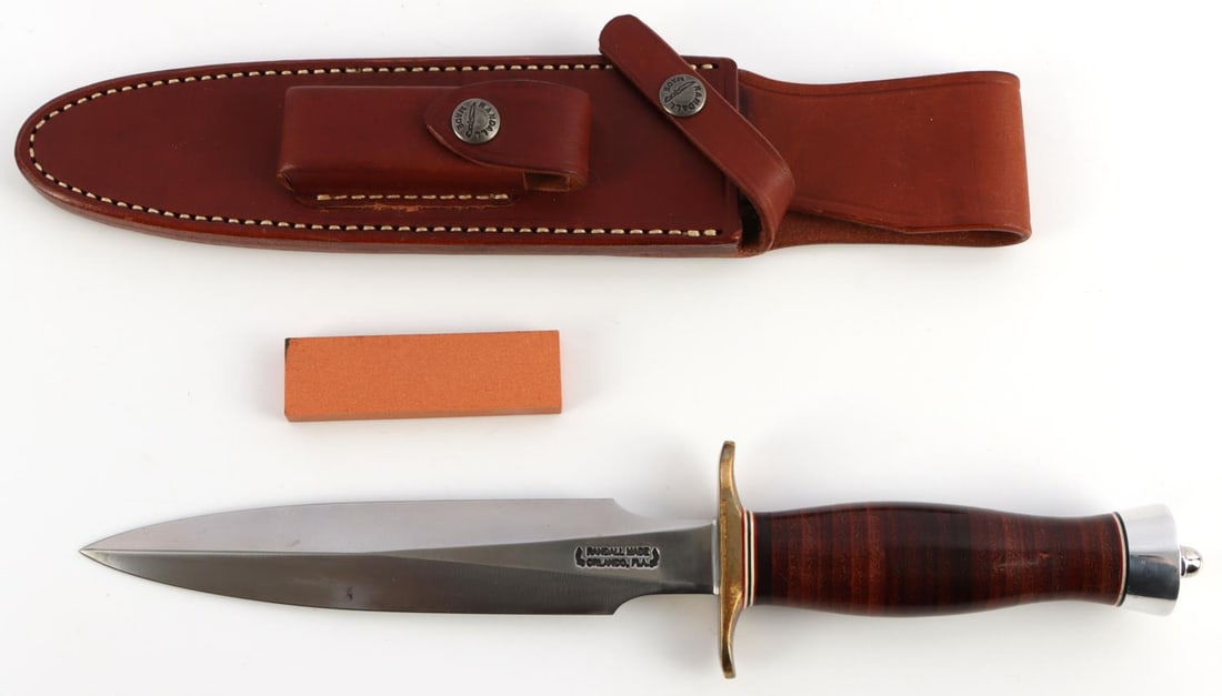 RANDALL MADE MODEL 2 FIGHTING STILETTO KNIFE: 7 inch blade of 1/4 inch stock. Brass double hilt. Approximately 4 5/8 inch leather handle. Duralumin butt cap. This is a heavily made dagger or dirk. The knife is shaped along the lines of a famous B