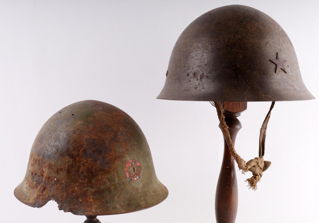 2 WWII JAPANESE IMPERIAL ARMY BATLEFIELD HELMET: One is complete with crude chinstrap, liner and star, the second is shell only. As photographed.