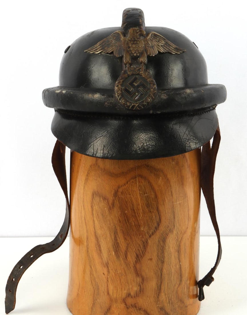 WWII GERMAN NSKK MOTORCYCLE HELMET: Very good original condition, named on liner, size Euro 56, moderate wear.