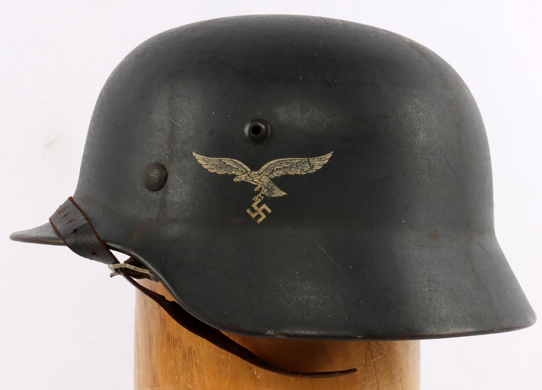 WWII GERMAN REICH LUFTWAFFE M35 HELMET W LINER: One of the finest examples we have seen. WWII German Reich Luftwaffe M35 double decal Stahlhelm combat helmet. Features German flag decal on the right and a Luftwaffe eagle on the left. Interior of th