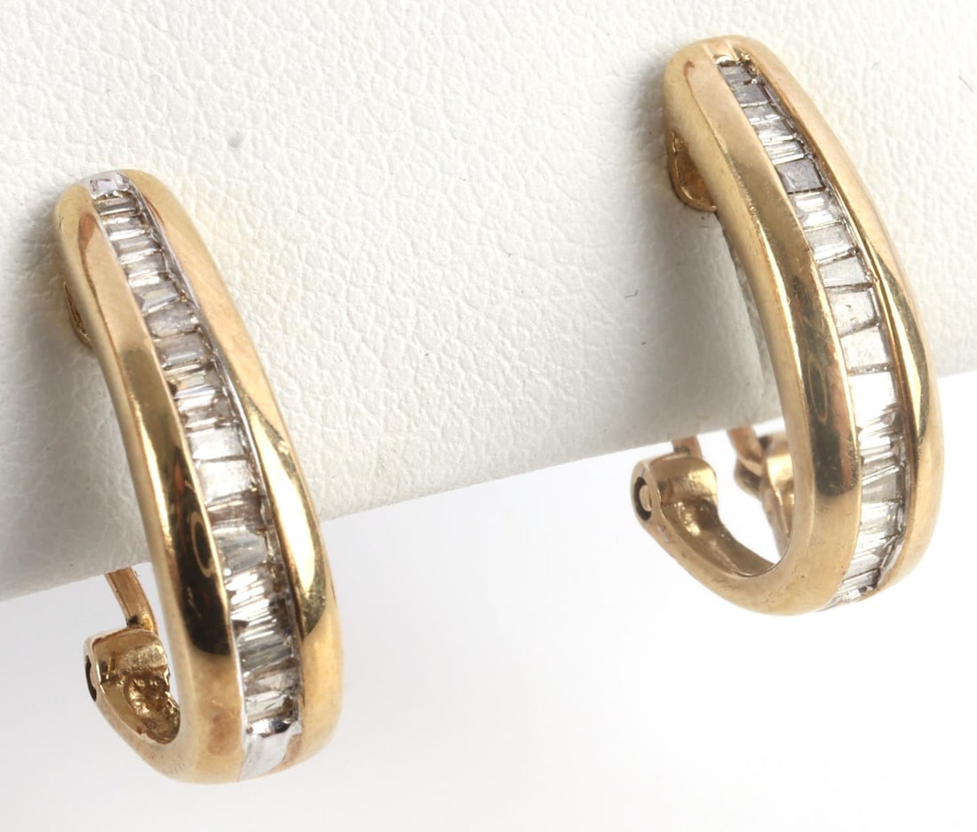 10K YELLOW GOLD DIAMOND LEVER BACK EARRINGS: Stamped "10K" inside hoop. Diamond baguettes measure 1.06x1.3 millimeters. Total weight 3.9 grams. This lot has a reserve.