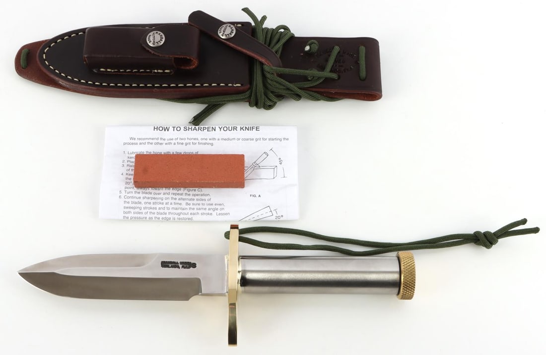 RANDALL MADE KNIFE MODEL 18 SURVIVAL W COMPASS: Avoid the 6 year waiting period for this quality American made knife. Model 18 has a 5 1/2 inch blade of 1/4 inch stock . Sawtooth edge on top (sawteeth not offset). Approximately 4 3/4 inch stainless