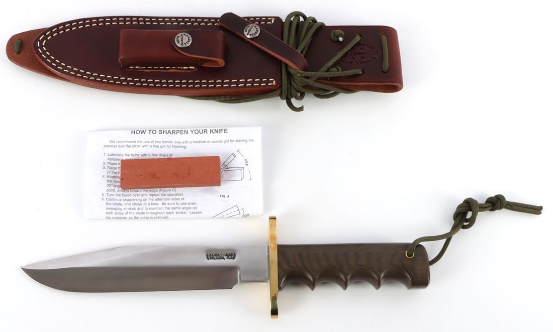 RANDALL MADE KNIFE MODEL 14 ATTACK WITH SHEATH: Avoid the 6-year waiting period for this quality American made knife. This Model 14 has a 7 1/2 inch blade of 1/4 inch stock. The top cutting edge is sharpened. A straight oblong hilt of 1/4 inch bras