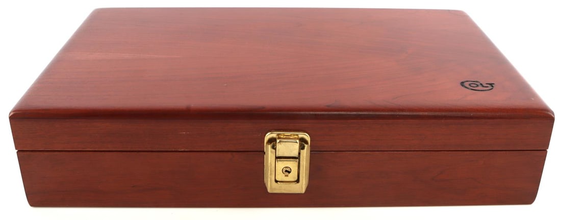 COLT WOOD PERCUSSION REVOLVER PRESENTATION CASE: Wooden Colt presentation box with keys which appears to be for a small percussion pistol or a Colt Single Action Army. Measures 15 inches wide by 9 1/4 inches long by 3 1/4 inches in height. In good c