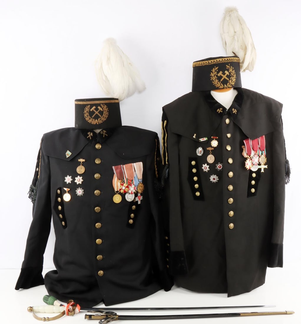 COLD WAR POLISH MINER PARADE GALA UNIFORM & SWORD: Lot of five (5) items from a Cold War era Polish miners parade uniform and sword. Lot includes two jackets, two gala hats, and one sword. Jackets include various medals like Polish Merit Crosses(gold,
