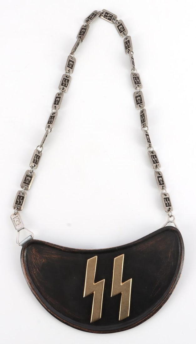 WWII GERMAN THIRD REICH WAFFEN SS GORGET AND CHAIN: WWII German Third Reich Waffen SS gorget and chain. Measures 8 inches wide by 4.25 inches tall. The front shows a pair of Waffen SS runes in the center of the Gorget, with neck chain. The reverse side