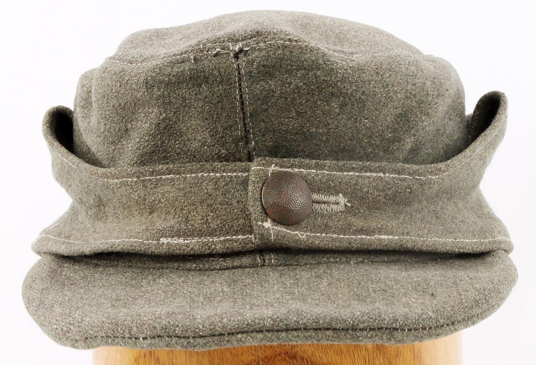 WWII GERMAN THIRD REICH M43 FIELD CAP: Size 59 marked with usage wear. Also marked R.B.Nr 0/0498/76. Pebbled button is also marked but difficult to discern. Non-fluorescing. Very good condition.
