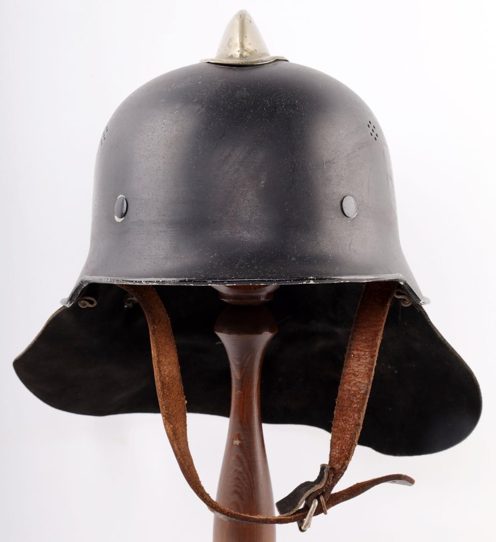 WWII GERMAN POLICE FIRE HELMET DOUBLE DECAL: Good original condition, comb is white metal and has a few small dents, decals are faint and scratched, good chinstrap and size 56 Euro liner, maker stamped rear under flap and 1934 date. Very good ex