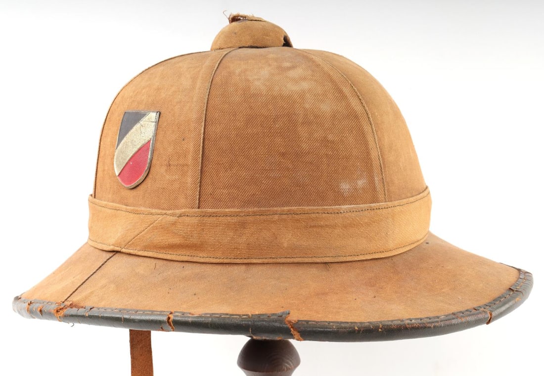 WWII GERMAN REICH HEER AFRIKA KORPS PITH HELMET: WWII German Reich Heer Afrika Korps tropical pith helmet. A double decal helmet that features a German Flag decal(right) and a Reichsadler decal(left). Interior features a sweatband(marked 53 for size
