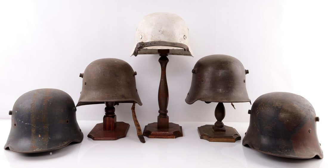 5 WWII GERMAN REICH M16 & M40 STAHLHELM HELMET LOT: Lot of five (5) WWII German Reich Stahlhelm Combat helmets including four M16 stahlhelms(one Austrian, three German) repurposed for WWII and lastly one white M40 Stahlhelm. Two M16's are marked "ET 64