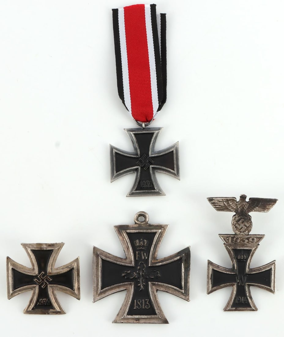 WWII GERMAN THIRD REICH IRON CROSS MEDAL LOT OF 4: 1 German 1914 iron cross first class officer's badge with 1939 first class clasp with eagle silver and black cross. 1 WWI Prussian German Iron Cross. 1 German Iron Cross with ribbon. German Iron Cross