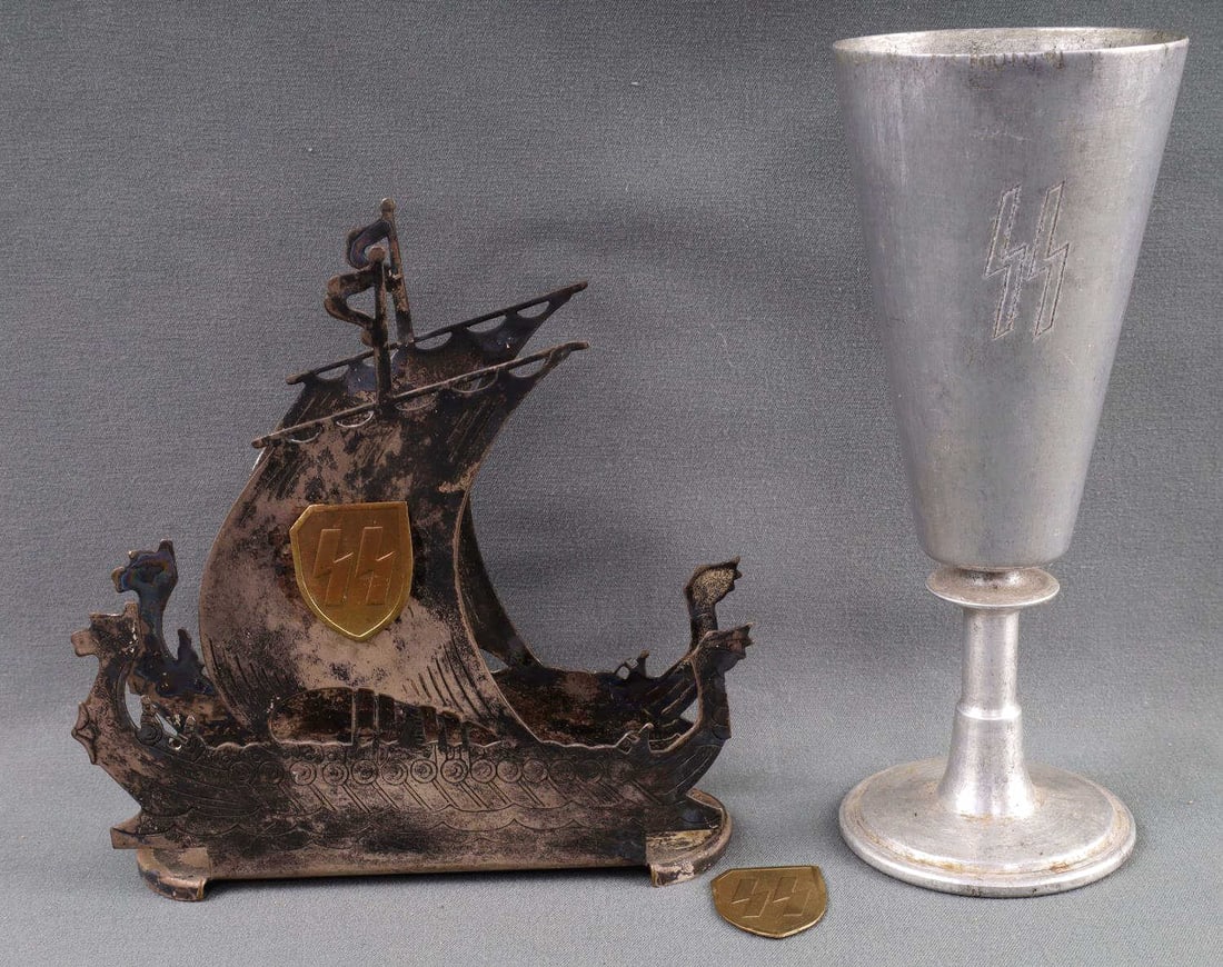 WWII GERMAN SS LIEBSTANDARTE DRINKING VESSEL: Vessel measures 5 1/2 inches, accompanied with Viking Longboat in tested silver (unmarked) mess napkin holder, 4 1/4 X 4 1/4 with SS runes.
