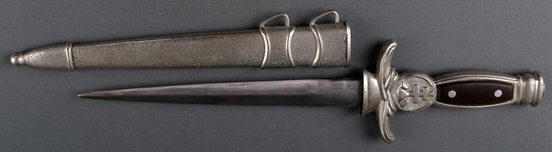 WWII SLOVAKIA M1939 ARMY OFFICERS DRESS DAGGER: In good condition with no markings on blade or handle. Bakelite grips in good condition. Missing leather blade spacer. Fits snuggly and tightly in scabbard. Sold as is.