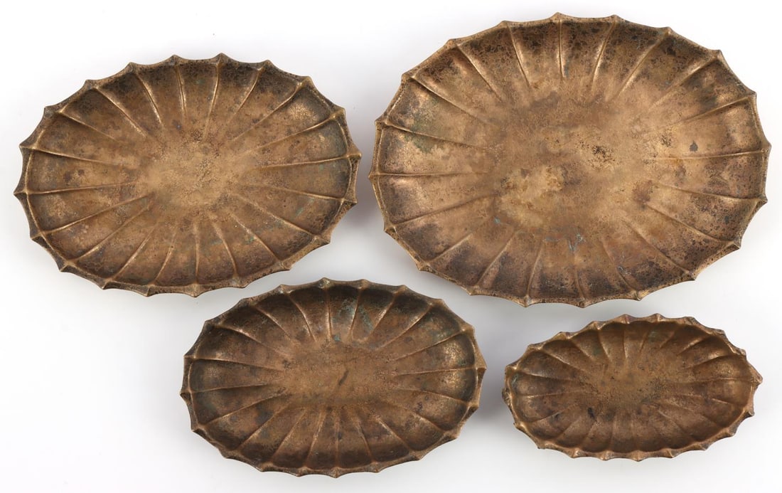 4 ANTIQUE TIFFANY STUDIOS NY BRONZE NUT TRAYS LOT: Lot of four (4) vintage Tiffany Studios, New York, bronze nut trays. Bottom side of each tray is stamped, "TIFFANY STUDIOS, NEW YORK, 1859. Bronze trays vary in sizes between 3 1/2 inches to 5 1/2 inc