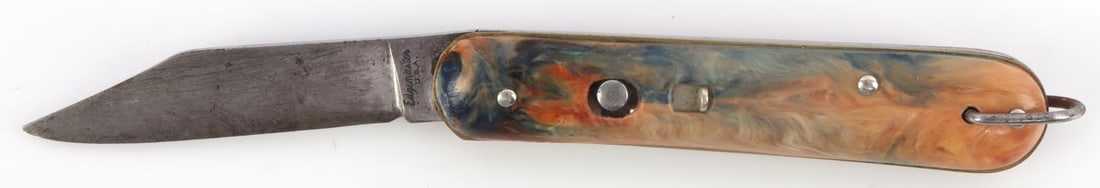 WWII US PARATROOPER EDGEMASTER SWITCHBLADE KNIFE: WWII US Paratrooper Edgemaster Switchblade Knife. Clip point blade with the ricasso marked, "Edgemaster U.S.A". Locking mechanism functions properly with a push button and multi-color swirl synthetic 