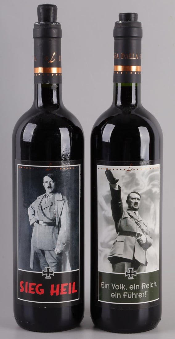 VINI LUNARDELLI AZIENDA HISTORY SERIES HITLER WINE: Lot of two (2) bottles from Vini Lunardelli Azienda. The "sieg heil" bottle is a 2006 Cabernet Franc; the "Ein Fuhrer" bottle is a 2007 Cabernet Sauvignon. Both are opened, with rubber corks. Both are
