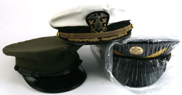 THREE US MILITARY HATS USMC NAVY AND ARMY: Three US Military visor caps. USMC, Navy, and Army. Army hat is unissued, in original wrap.