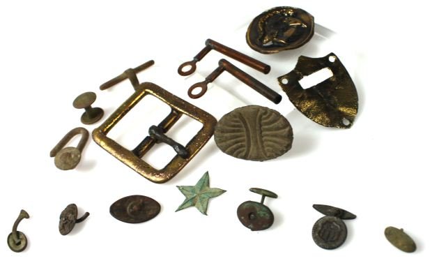 CIVIL WAR BATTLEFIELD DUG RELICS W 12TH CORP BADGE: Collection of excavated relics in five frames; cuff links, Cavalry pieces, knapsack buckles, friction primers, and a 12th corps five pointed star badge.