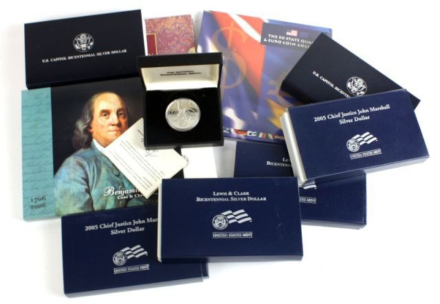 MIXED LOT OF SILVER DOLLARS CURRENCY & SETS: Includes two 2004 Lewis & Clark silver dollars (one proof and one uncirculated), two 2005 Chief Justice John Marshall silver dollars (one proof and one uncirculated), two 1994 US Capital Bicentennial