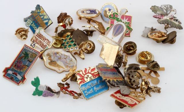 SMALL LOT OF LAPEL PINS: Small collection of thirty-two lapel pins, various sizes, designs, themes, colors, vocations, occasions. From Coca-Cola to Springtime Tallahassee to the Sugar Bowl. Weight: 116.0 Condition: Overall go