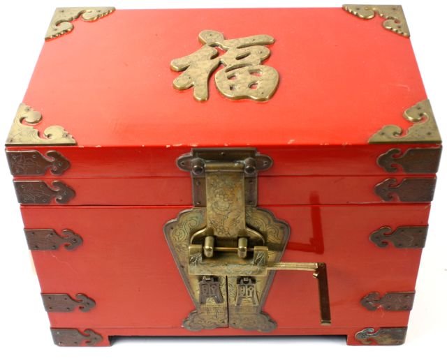 VINTAGE CHINESE JEWELRY BOX: Measures 14 by 9 by 9.5 inches. Wood box with metal corner and hinges. Includes Chines lock and key. Decorated with Chinese characters on top and on the handles. In very good condition.