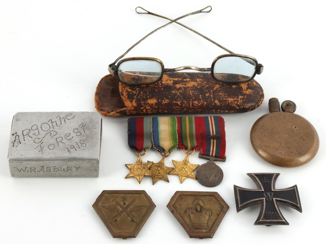 WWI WWII MEDAL IRON CROSS & TRENCH ARTIFACTS LOT: Lot of American, German, French and British WWI and WWII artifacts. Includes American WWI trench art matchbox inscribed "Argonne Forest 1918, W.R. Asbury" with Renault FT-1 tank, circular brass trench