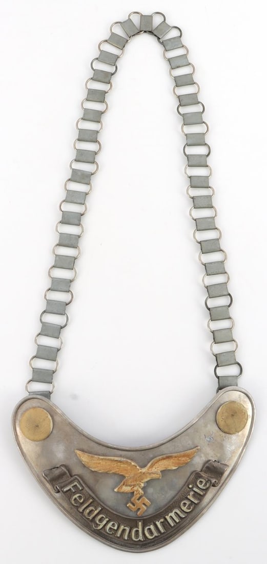 WWII GERMAN LUFTWAFFE FELDGENDARMERIE GORGET: Still phosphorus, an area of scratching upper right, reverse left lugg has Luftwaffe eagle and 1939 date.