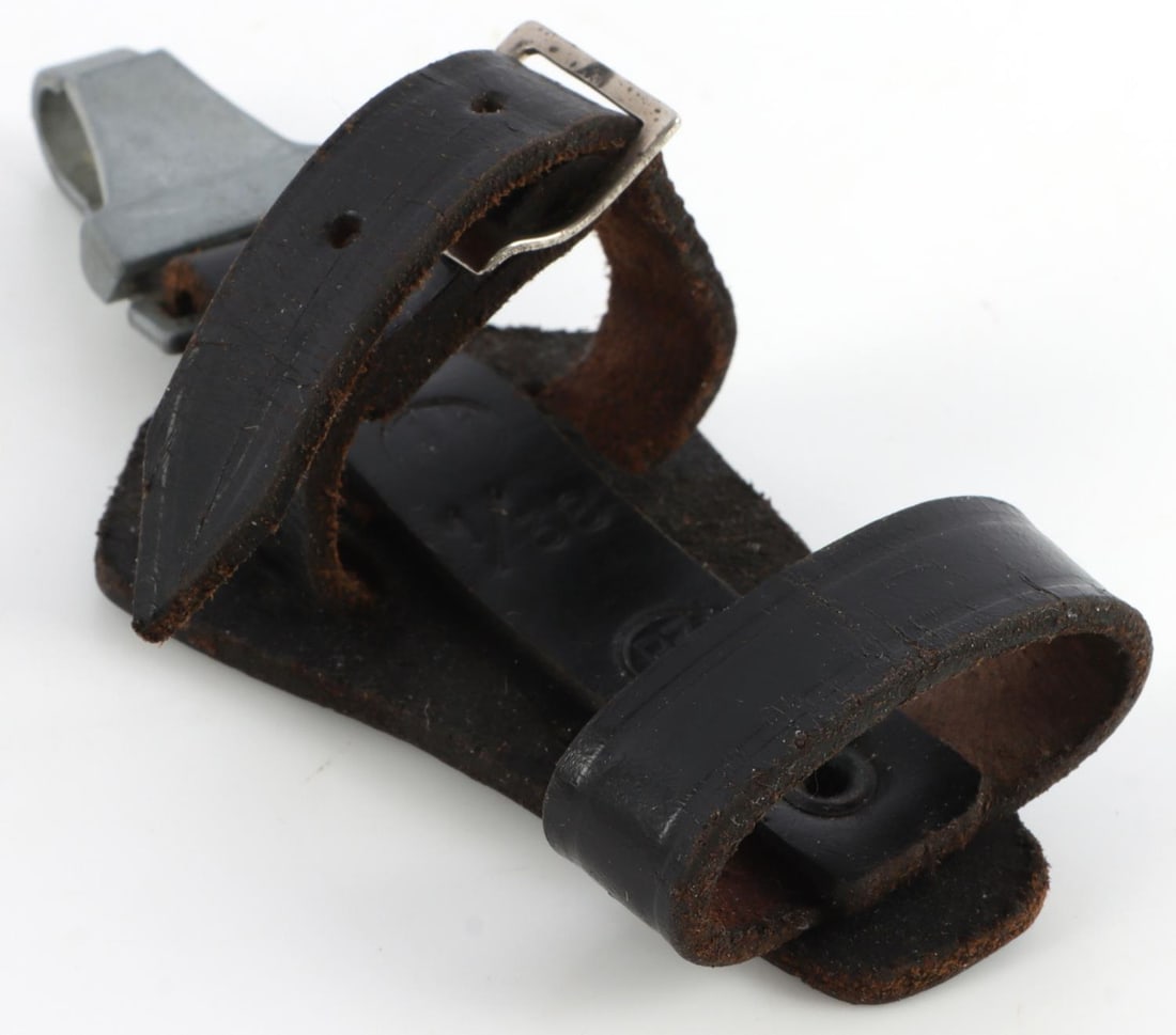 WWII GERMAN SS VERTICAL DAGGER HANGER DRGM SS RZM: Vertical hanger with zinc clasp. Marked DRGM, SS, RZM, 1/38. Measures 4 7/8 inches.