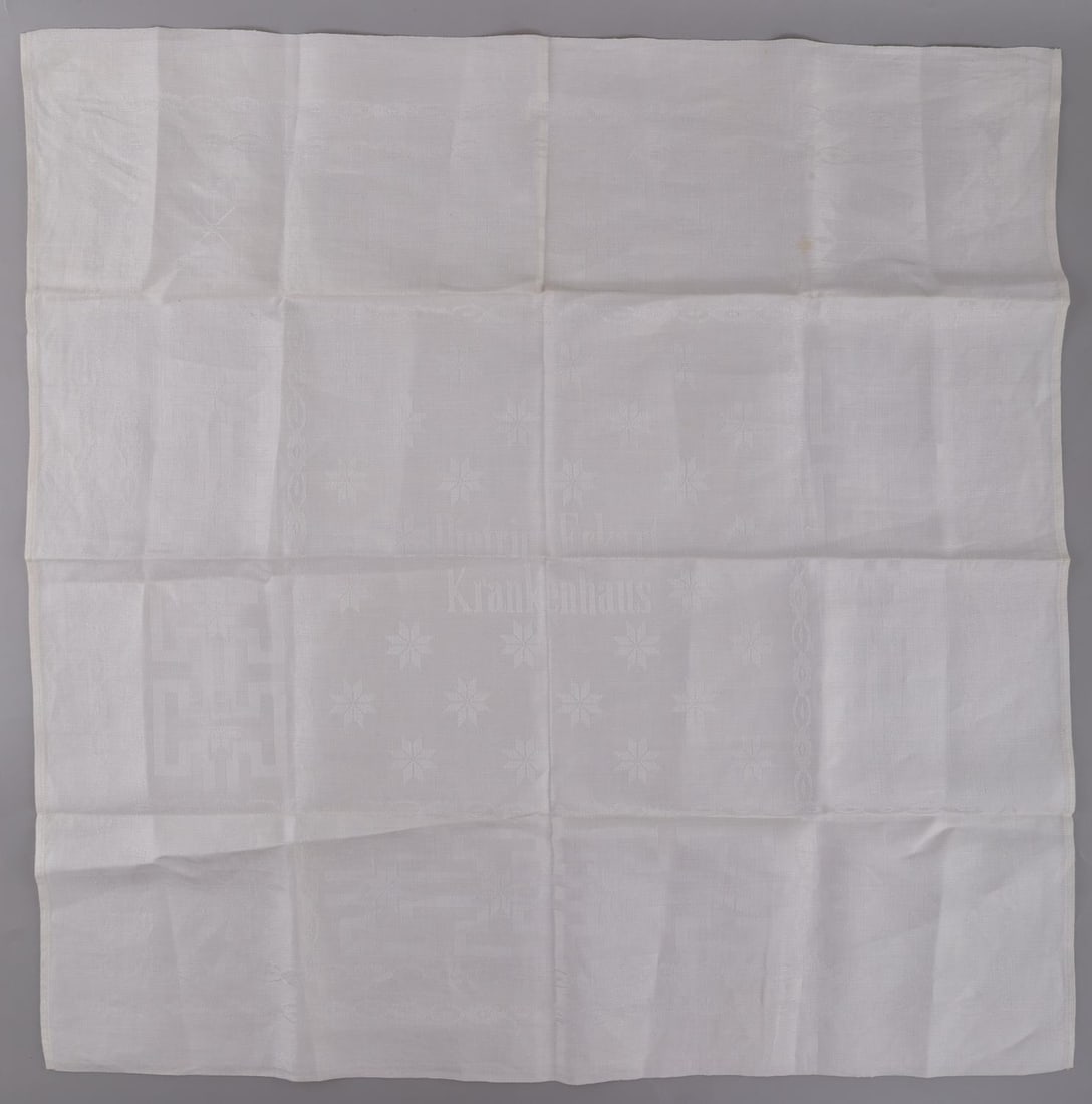 WWII GERMAN DIETRICH ECKART KRANKENHOUSE NAPKIN: WWII German Reich "Dietrich Eckart Krankenhause" fine linen napkin. Dietrich Eckart Krankenhause is a hospital built between 1938 and 1942 named after Dietrich Eckart. Napkin features "Dietrich Eckart