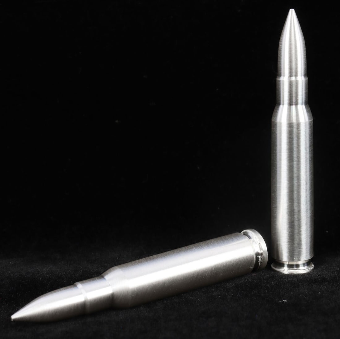 SILVER BULLET BULLION ROUND .308 CAL 4 OZ TOTAL: Lot of TWO 2 oz. silver bullets (.308 cal.) modeled after the distinguished .308 Winchester rifle ammunition. Each contain .999 fine silver. This lot has a reserve.