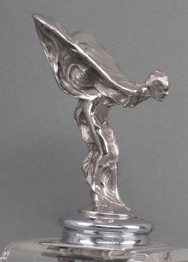 ANTIQUE ROLLS ROYCE HOOD ORNAMENT: At base, "Rolls Royce Motors Limiter". Early ornament with stand. Measures 8 inches. 0