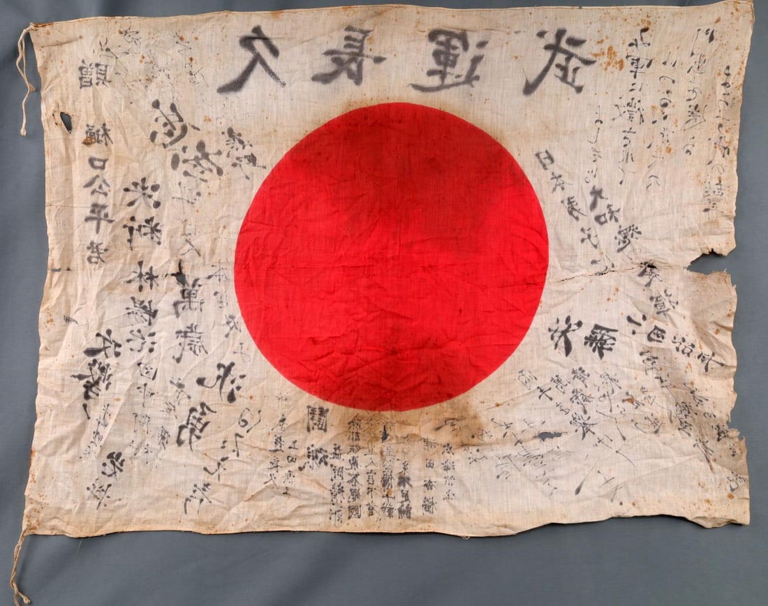 WWII CAPTURED SIGNED JAPANESE MEATBALL FLAG: Original as found condition, stained with holes, at what appears to be a period repair, thread has same patination. Measures 28 X 37 inches. 0