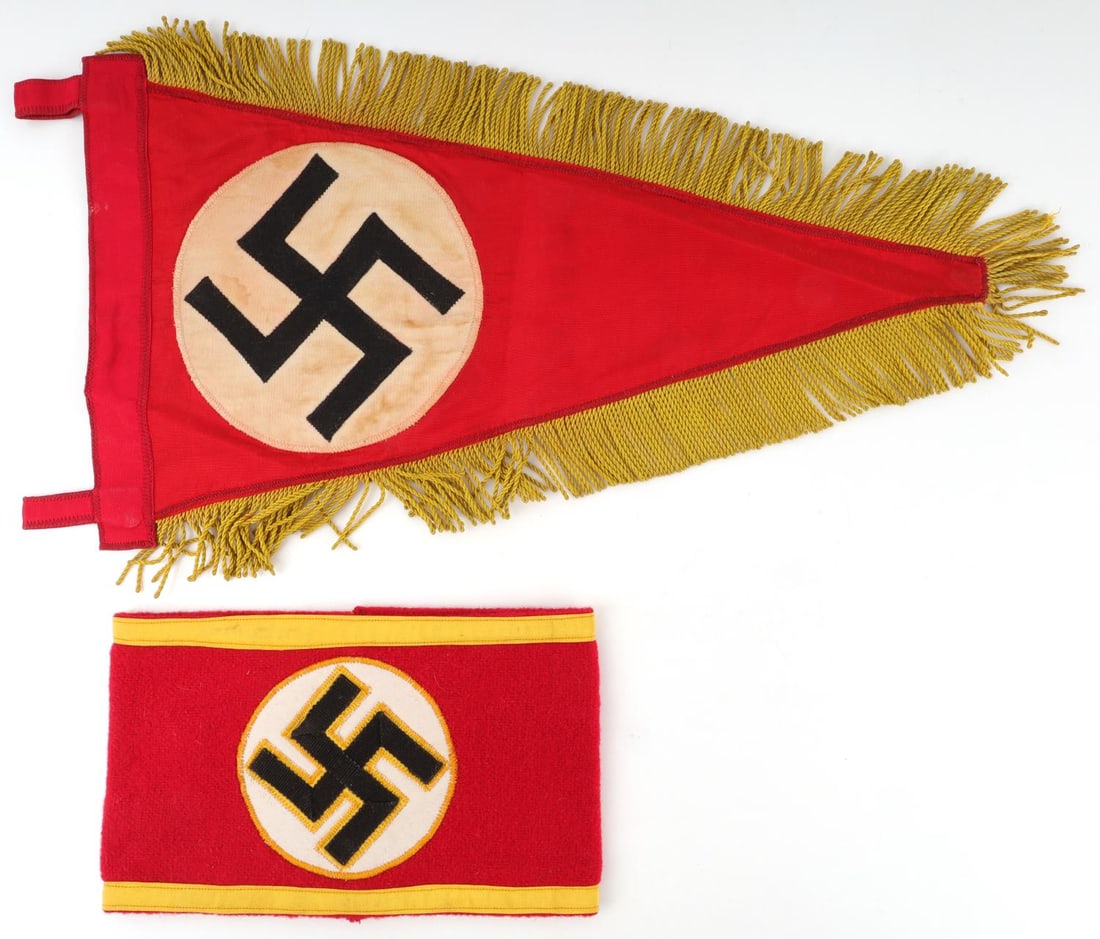 WWII GERMAN REICH PARTY LEADER ARMBAND & PENDANT: Lot of two (2) WWII German Reich NSDAP Party leader items including an armband and a car pendant. Armband has multi-piece cotton construction, pendant is nylon with fabric fringe. Neither item has mar