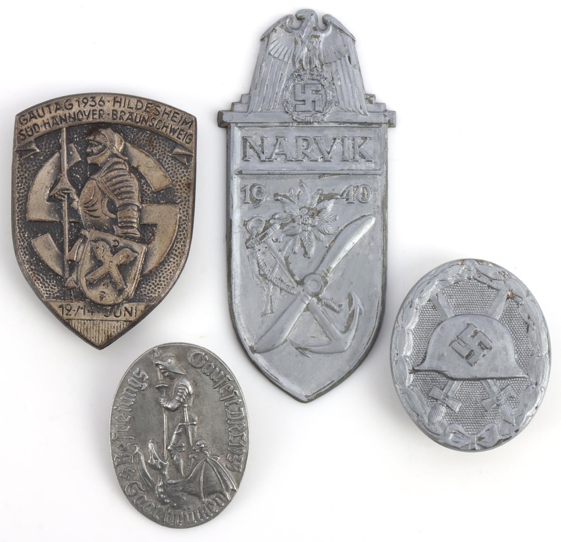 4 WWII GERMAN REICH NARVIK SHIELD & GAUTAG TINNIES: Lot of four (4) WWII German Reich tinnies and a shield badge including a Narvik 1940 Shield badge, a silver wound badge (marked, 107), a Gautag 1936- Hildesheim tinnie, and lastly a Gaufest DRL Sport 