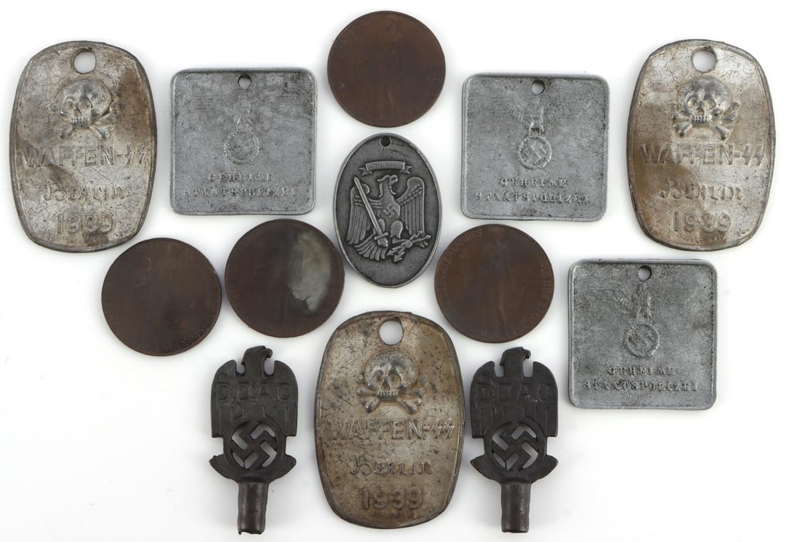 LOT OF 13 WWII GERMAN THIRD REICH TAGS AND COINS: Lot of 13 WWII German tags and medals. Includes 7 police identification tags, 2 DDAC flag pole toppers, and 4 commemorative 1936 Olympic Games coins. Unauthenticated, sold as-is. 0