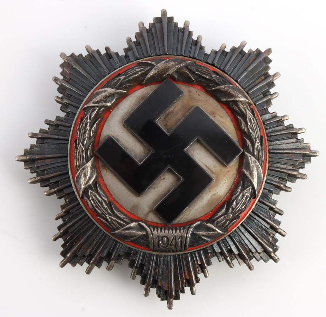 WWII THIRD REICH GERMAN CROSS IN SILVER: Multi-piece construction with 4 rivets. Marked 134. Measures 2 1/2 inches. Very good condition with wear. Unauthenticated, sold as is. 0