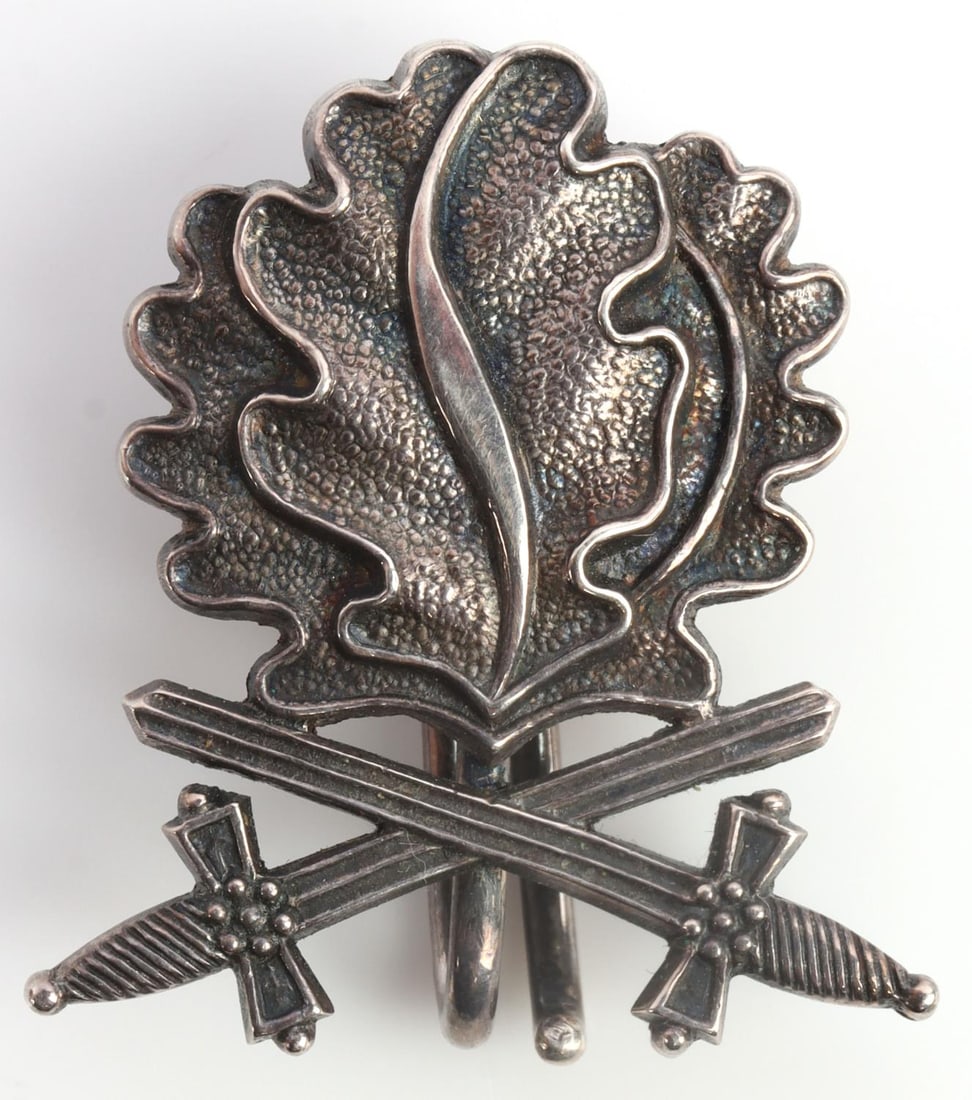 WWII GERMAN IRON CROSS OAK LEAF AND CROSSING SWORD: 800 marked. Measures 1 1/8 inches. Very good condition. Unauthenticated, sold as is. 0