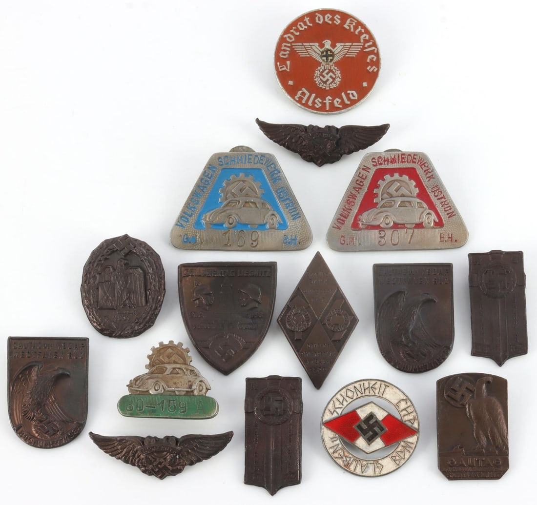 LOT of 15 WWII GERMAN THIRD REICH BADGES TINNIES: Lot of fifteen (15) various WWII German Third Reich badges and tinnies, including three (3) different Volkswagen enamel badges, two (2) Luftschutz eagles, and more. Unauthenticated, sold as-is. 0