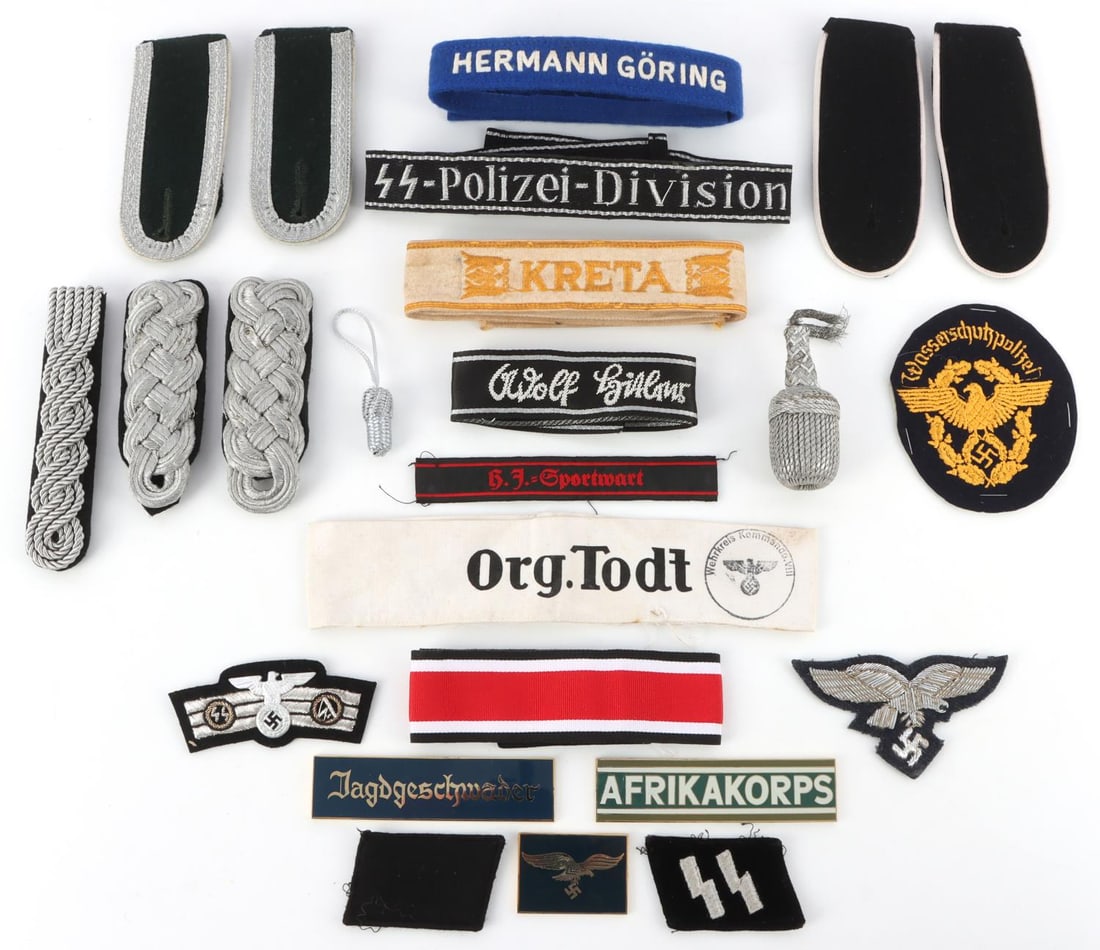 LOT OF 23 WWII GERMAN THIRD REICH UNIFORM ITEMS: Lot of 23 items total. Includes shoulder boards, collar tabs, plaques, cuff titles and more. Unauthenticated, sold as-is. 0