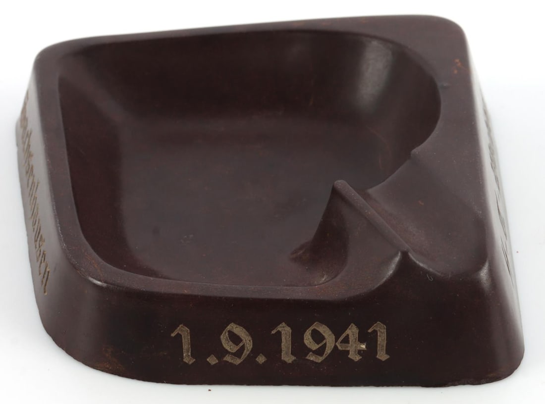 WWII THIRD REICH SS SACHSENHAUSEN ASHTRAY: WWII German ashtray with a totenkopf on the side. The date 1.9.1941 appears on another side. One side has the "SS - T. - Wachbtl." while another side has the word "Sachsenhausen." Bottom of ashtray ha