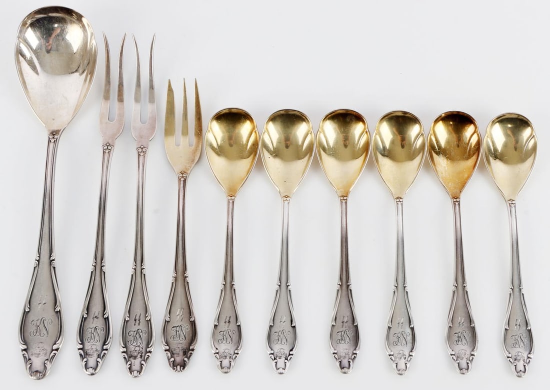10 WWII GERMAN REICH WAFFEN SS SILVERWARE UTENSILS: Lot of ten (10) WWII German Reich Waffen-SS Silverware utensils including cocktail forks (3) and spoons (7). Each utensils handle features SS runes, the initials "KN", and a totenkopf skull. The rever