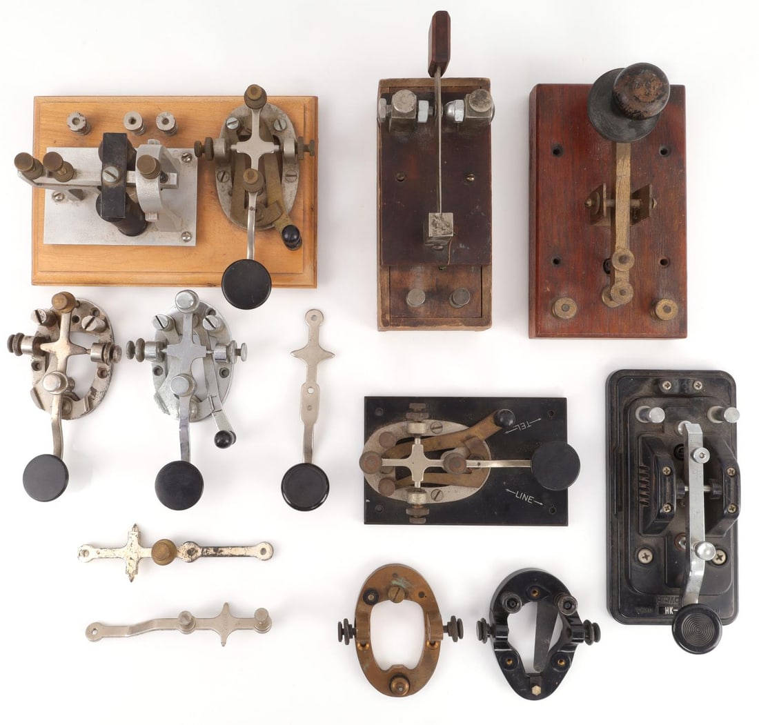 OLD WEST TO WWII TELEGRAPH KEY LOT: Includes one 19th century wood and white metal, one with written on bottom that it is a WWI Spark call, Hi Mound key Army Signal Corp, Bakelite base, parts and more. This lot has a reserve.